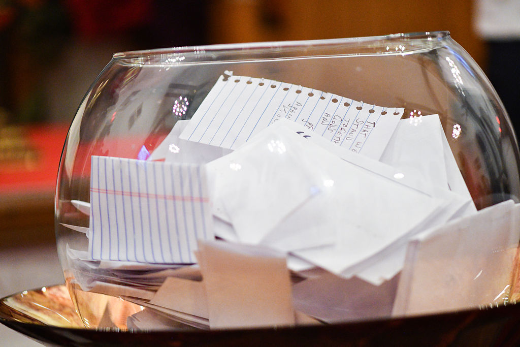 Notes from attendees sit in a bowl